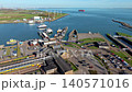 Aerial view of Vlissingen railway station and ferry terminal port with trains, ships, and harbor infrastructure in Zeeland, Netherlands. 140571016