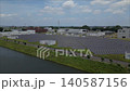[Aerial Video] Blue Sky and Mega Solar Power Plant: A Solar Power Plant Adjacent to a Water Treatment Plant - A Landscape of Renewable Energy 140587156