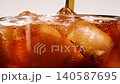 Slow motion closeup pouring cola with ice cubes and bubbles, soft drink texture 140587695