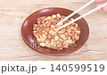 baked salty red peel peanut arranging on plate picking by chopsticks 140599519