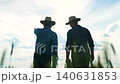 agriculture, businessmen two farmers wheat field, two farmers walking through wheat field, men working green wheat field, businessmen field, growing grain crop, grain harvest, industrial production 140631853