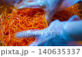 Preparing Fermented marinated carrot salad. Korean style Healthy food. Hang carrot salad by hand 140635337