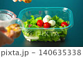 Prepare lunch chicken salad for work in plastic containers. Healthy food. Potato 140635338