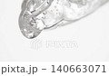Closeup cosmetic serum fluid gel with bubbles from dropper, pipette over white 140663071