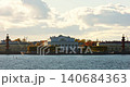 Russia, St.Petersburg, Old stock exchange building, pleasure boats in the Neva River at sunset, the drawbridge Palace, the cabinet of curiosities Museum, Rostral columns, shipyards 140684363
