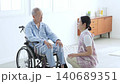 Caregivers who support elderly people in wheelchairs 140689351