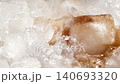 Slow motion closeup pouring cola with ice cubes and bubbles, soft drink top view 140693320