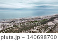 Aerial view of coastal landscape with winding path and ocean horizon 140698700