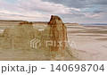Aerial view of rock formations in arid landscape with dramatic cloud patterns 140698704