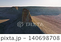 Aerial view of rocky cliffs and desert landscape under bright sunlight 140698708