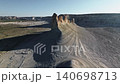 Aerial view of dramatic rock formations in arid landscape under clear sky 140698713