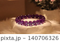 Amethyst stone bracelet on rotating display stand spins slowly 140706326