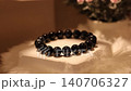 Blue tiger eye stone bracelet on rotating display stand 140706327