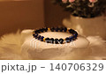 Natural stone bracelet shows off on rotating display stand 140706329