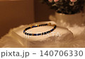Minimal natural stone bracelet on rotating display stand in close view 140706330