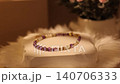 Natural stone bracelet on display stand shows details and colors 140706333