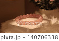 Rose quartz stone bracelet on rotating display stand 140706338