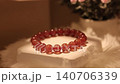 Strawberry quartz stone bracelet on rotating display stand 140706339