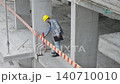 Construction site manager inspecting building progress 140710010
