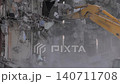 Excavator with shovel bucket is tearing down the building: slow motion 140711708