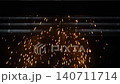 Numerous sparks fly as a CNC laser cutter operates on sheet metal: slow motion 140711714