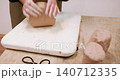Pottery workspace. Clay modeling. Unrecognizable woman specialist hands molding raw for ceramic crockery in professional workshop. 140712335