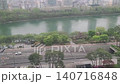 High-Angle View of Seokchon Lake Walkway and Cars Passing Through the Underpass in Seoul 140716848
