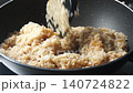 Preparing and cooking traditional Chinese food, Zongzi or sticky rice dumpling wrapped in leaves. 140724822