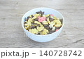 dry assorted flavor of cereal breakfast pouring fresh milk from bottle glass and scooping to eat on bowl 140728742