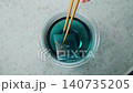 Remove the butterfly pea tea bag after brewing. 140735205