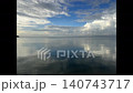 石垣島･船越漁港の海 鏡のような水面　幻想的　美しい海と空　青空と白い雲 140743717
