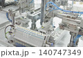 Pneumatic robotic arm in industrial automation system. Automated manufacturing process simulation in smart factory environment. 140747349