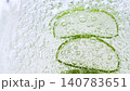 Serum gel texture with aloe vera leaf and bubbles, transparent cream background 140783651