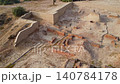 Ancient Harappa ruins show a public well washing area brick homes and open drains that reflect advanced city planning and daily life 140784178