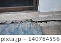 Cracks in concrete at building entrance in urban area observed 140784556