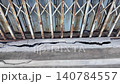 Cracks in concrete at building entrance in urban area observed 140784557