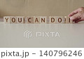 motivational phrase you can do it, laying out  by hand from letters on wooden cubes, slow motion 140796246
