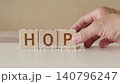 motivational word hope, laying out  by hand from letters on wooden cubes, slow motion 140796247