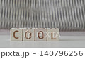 motivational word cool !, laying out  by hand from letters on wooden cubes, slow motion 140796256