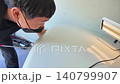 Removing dents on the car. PDR technology. Car body repair without painting. 140799907