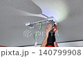 Person changing kitchen ceiling bulb. Person performing do it yourself task to update kitchen ceiling illumination 140799908