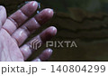 Hands touching the free-flowing cypress hot spring water 140804299