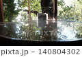 Hands touching the free-flowing cypress hot spring water 140804302