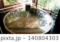 Hands touching the free-flowing cypress hot spring water 140804303