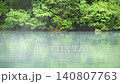 The scenery of Lake Yunoko with its fresh greenery in early summer and rising steam. 140807763