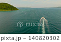 Drone footage showing a beautiful blue sea and boats from above. 140820302