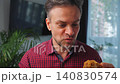 Junk food advertisement concept. Man eating fried chicken, enjoying fast food. 140830574