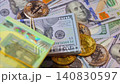 Background with US Dollar and Euro bills, BTC bitcoins rotating 140830597