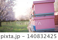 Bees departing and returning to pink beehives in a blooming almond orchard for pollination. Slow motion 140832425