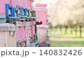 Bees departing and returning to pink beehives in a blooming almond orchard for pollination. Slow motion 140832426
